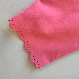 Adorable coral color pants with cute trim.